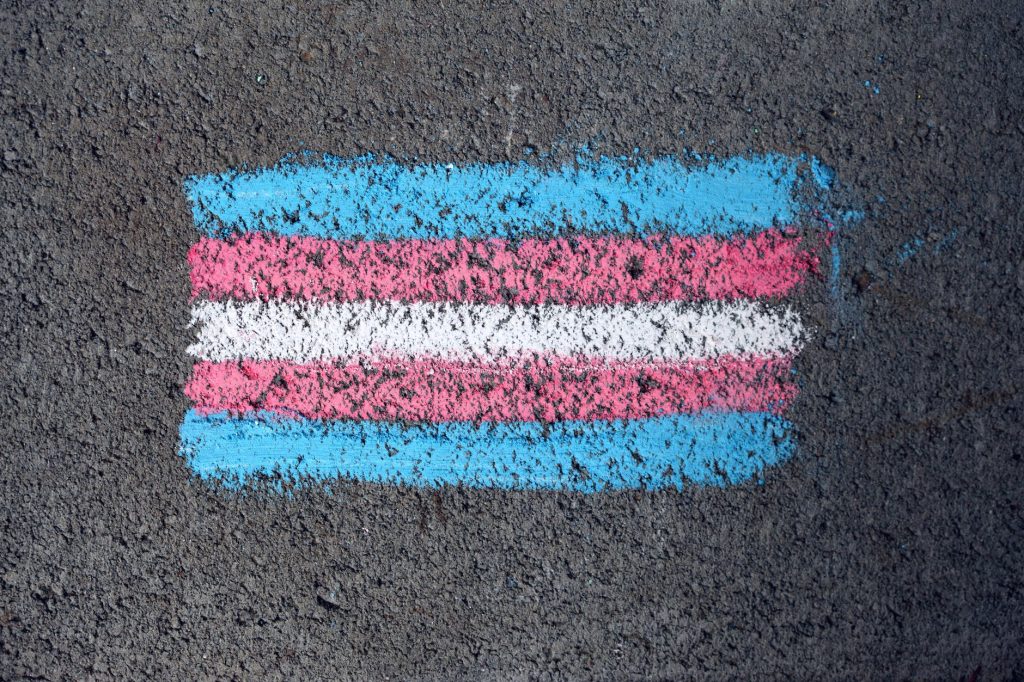 a pride flag drawn on the ground